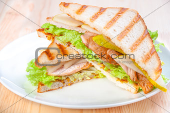 sandwich with turkey, cheese and vegetables, pears