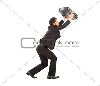 terrified businessman using briefcase to protect. 