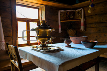brass samovar on the table in the Russian hut