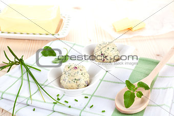 Dairy products. Butter and herbal butter on wooden table.
