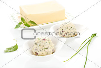 Dairy products. Butter and herbal butter on white background.