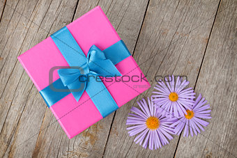 Purple gift box and gerbera flowers