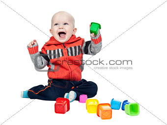 little boy with a plastic pyramid in the studio