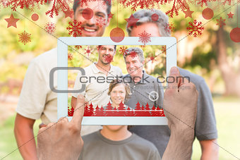 Composite image of hands holding tablet pc
