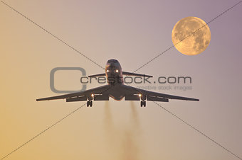 Landing of the plane at sunset.