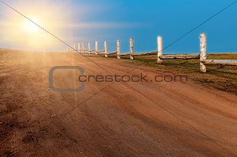 Fence along the gravel road