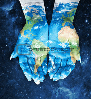 Map painted on hands.Concept of having the world in our hands in