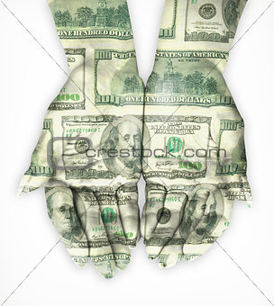 Hand coated in dollar banknotes. Isolated on white
