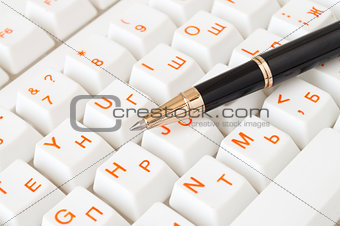 keyboard and pen isolated on white background