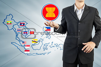 ASEAN Economic Community in businessman hand 