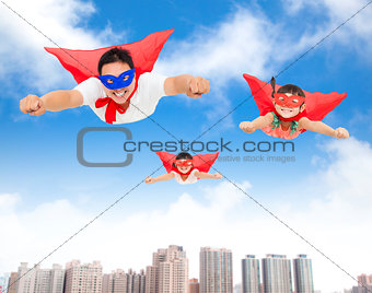 superman and daughters  flying in the sky