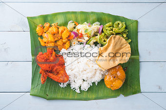 Indian banana leaf rice on table