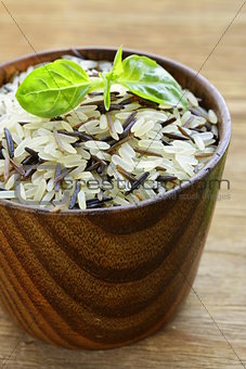 mix of wild black and white rice in a wooden bowl