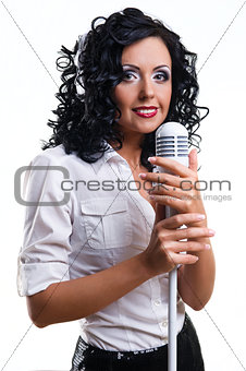 Beautiful young woman with headphones and microphone