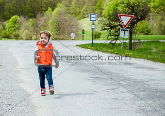 Baby walking on the road