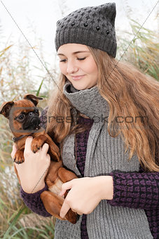 Sweet winter teenager and her little dog