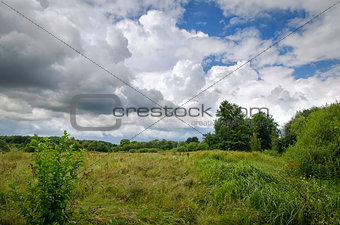 Summer landscape with low clouds