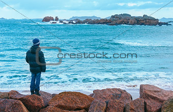 Boy and Tregastel coast view (Brittany, France)