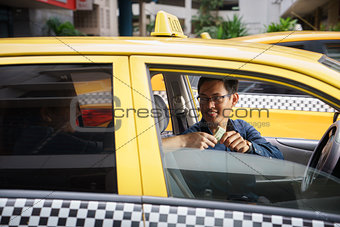 taxi driver driving car happy client paying money