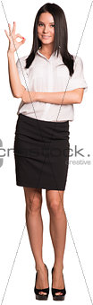 Beautiful businesswomen standing and showing ok hand sign