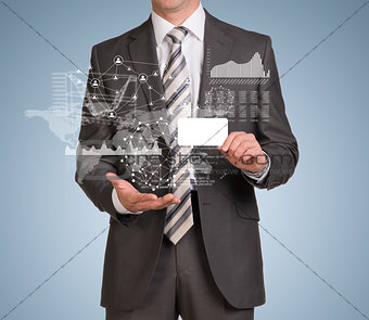Businessman hold empty card and graphs, world map, network