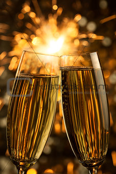 Beautiful golden champagne with sparklers - vertical