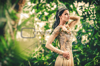 Gorgeous lady in evening dress and with tiara on a head