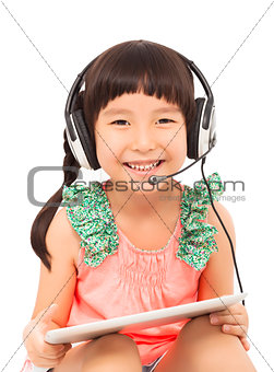 closeup of little student girl holding a tablet