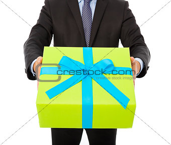 Businessman holding a gift. isolated on white