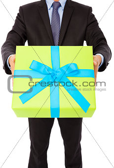 Businessman holding a gift. isolated on white background