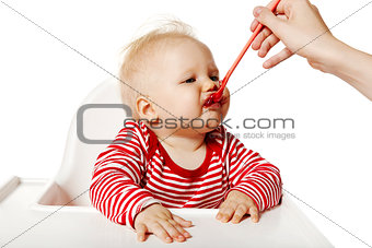 Feeding. Baby Eating Dinner