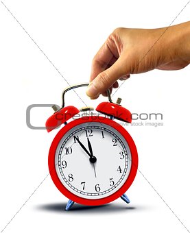 Hand Holding Alarm Clock