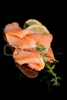 Culinary seafood. Salmon isolated on black.