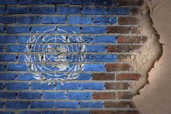 Dark brick wall with plaster - United Nations