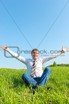 happy businessman enjoys the sun in nature