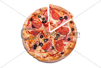 Tasty pizza with ham and tomatoes with a slice removed 