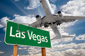 Las Vegas Green Road Sign and Airplane Above