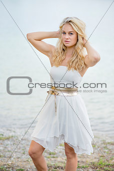 Blond woman in white dress