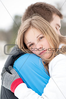 Gentle embrace of a young couple in love