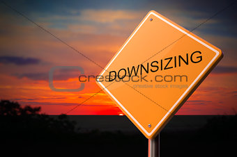 Downsizing on Warning Road Sign.
