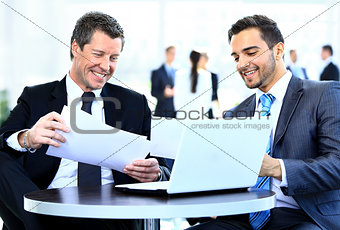 Business men discussing together in an office