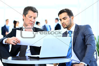 Business men discussing together in an offic