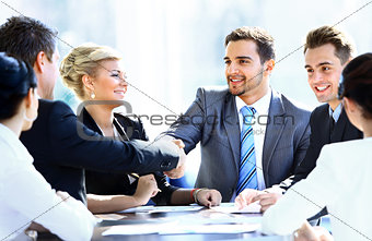 Business colleagues sitting at a table during a meeting