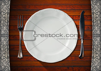 Empty Plate on Wooden Table with Cutlery