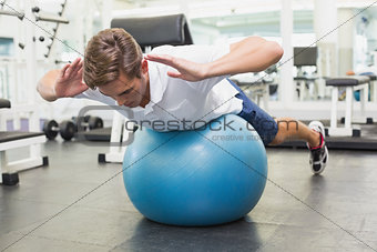Man in plank position on exercise ball