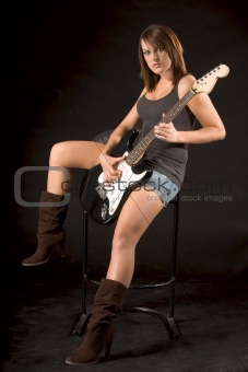 Young female rock guitarist