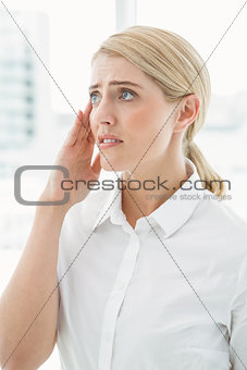 Young businesswoman with headache