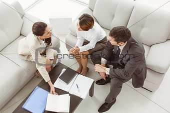 Couple in meeting with financial adviser at home