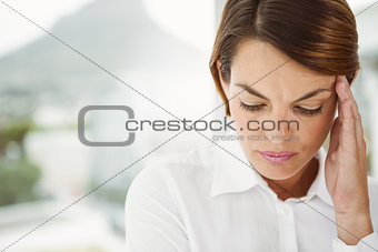 Businesswoman with headache at office