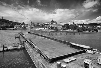 View on the spring Prague gothic Castle and big tugboat, Czech R